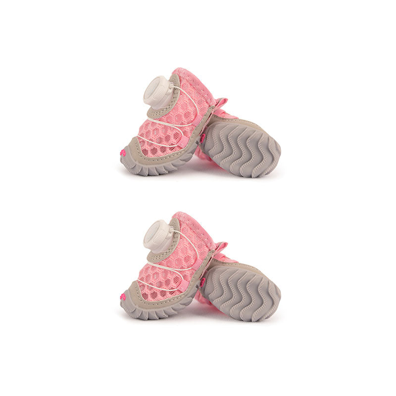 Bubblegum pink mesh dog shoes with gray tread soles and quick-dial fasteners.