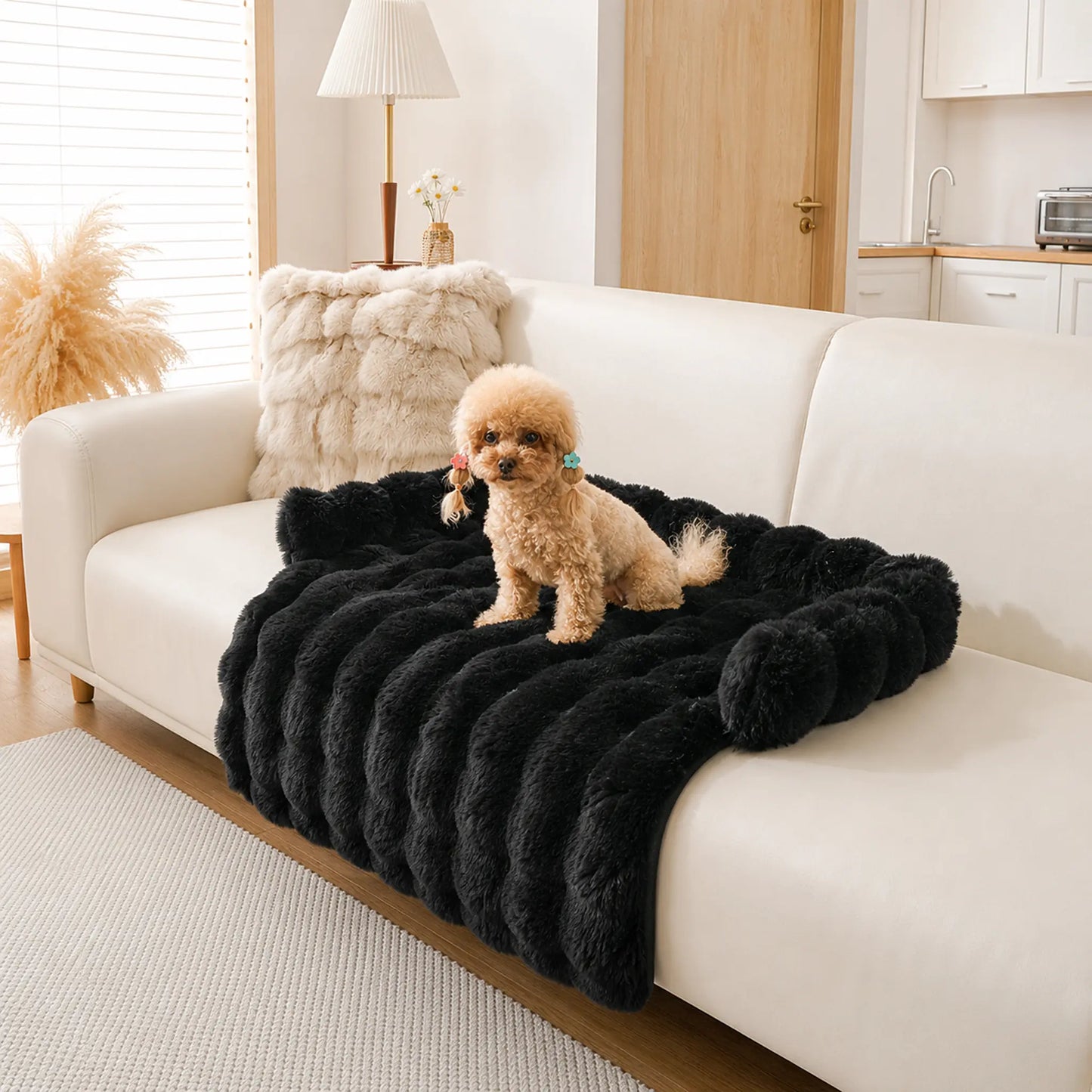 Black faux-fur pet sofa cover with bolster on a beige couch, toy poodle on it