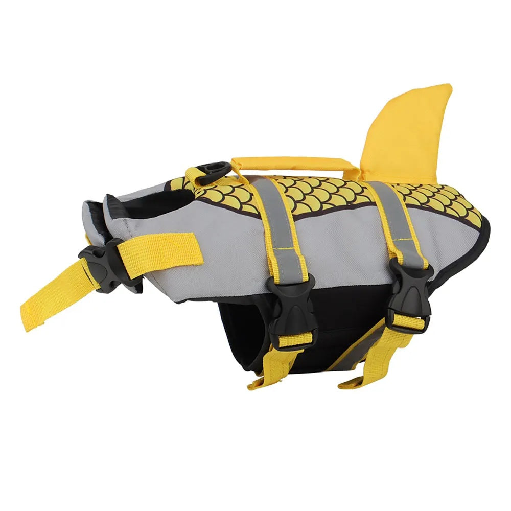 Bright sunny yellow dog swim vest with a playful shark fin and fish tail detail on a white background.