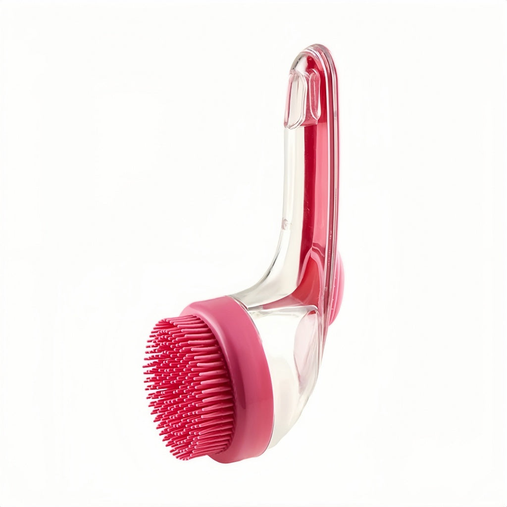 Pink 2-in-1 pet bath massage brush with silicone bristles and clear shampoo dispenser on a white background.