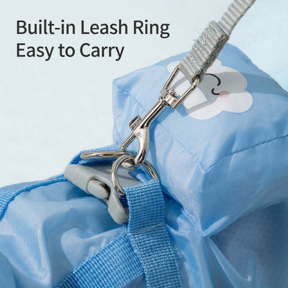 Close-up of the built-in leash ring and clip attachment on the sky blue full-body dog raincoat.