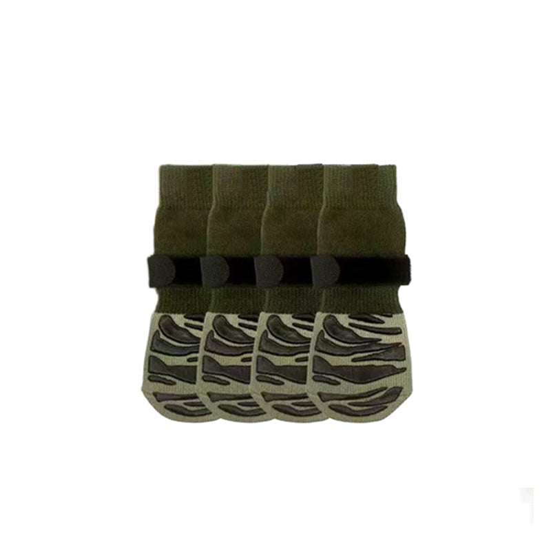 Olive green anti-slip dog socks with black grips, shown as four leg warmers on a white background.