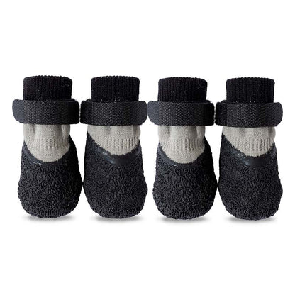 Four black and gray waterproof anti-slip dog socks with Velcro straps, arranged on a white background.