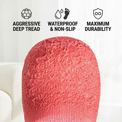 Close-up of a red waterproof non-slip dog sock sole with deep tread texture on a white background.