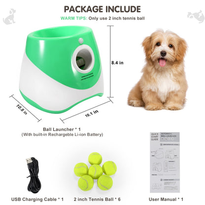Studio shot on white background shows an automatic dog ball launcher, six 2-inch tennis balls, USB cable, and a small fluffy dog.