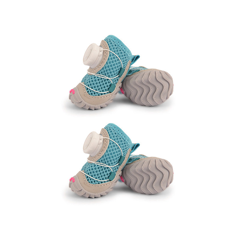 Ocean blue mesh dog shoes with gray tread soles, white cord laces, and quick-dial fasteners.