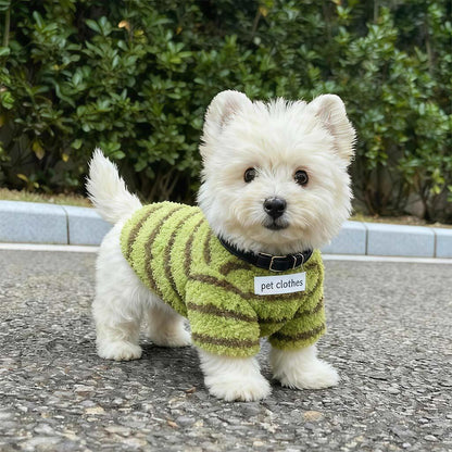 White Westie outdoors wearing the matcha green striped fleece dog sweater with black collar.