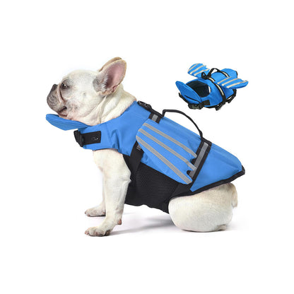 French bulldog wearing a blue angel wing dog life jacket, shown on a white background with a small inset view.