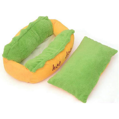 Hot dog pet bed with removable green inner cushion shown beside the yellow outer bed frame.