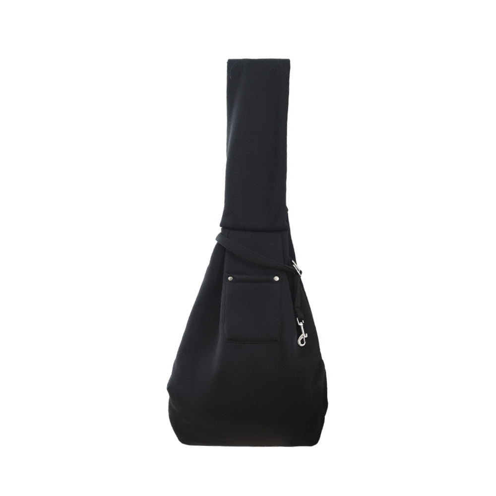 Midnight black pet sling carrier with front pocket, safety clip, and wide crossbody strap.