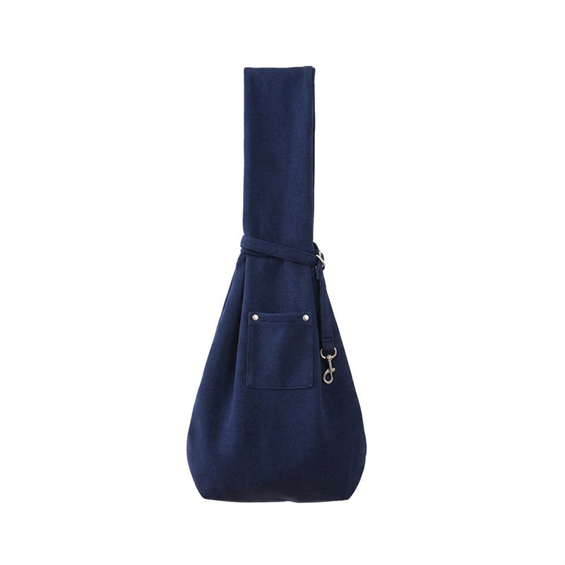 Navy blue pet sling carrier shown on a white studio background with crossbody strap.