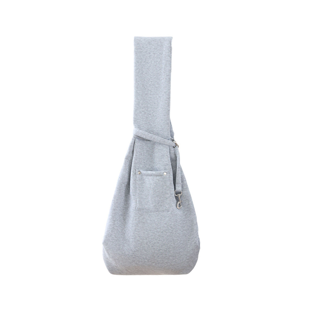 Heather gray pet sling carrier with front pocket, strap clip, and checkered interior.