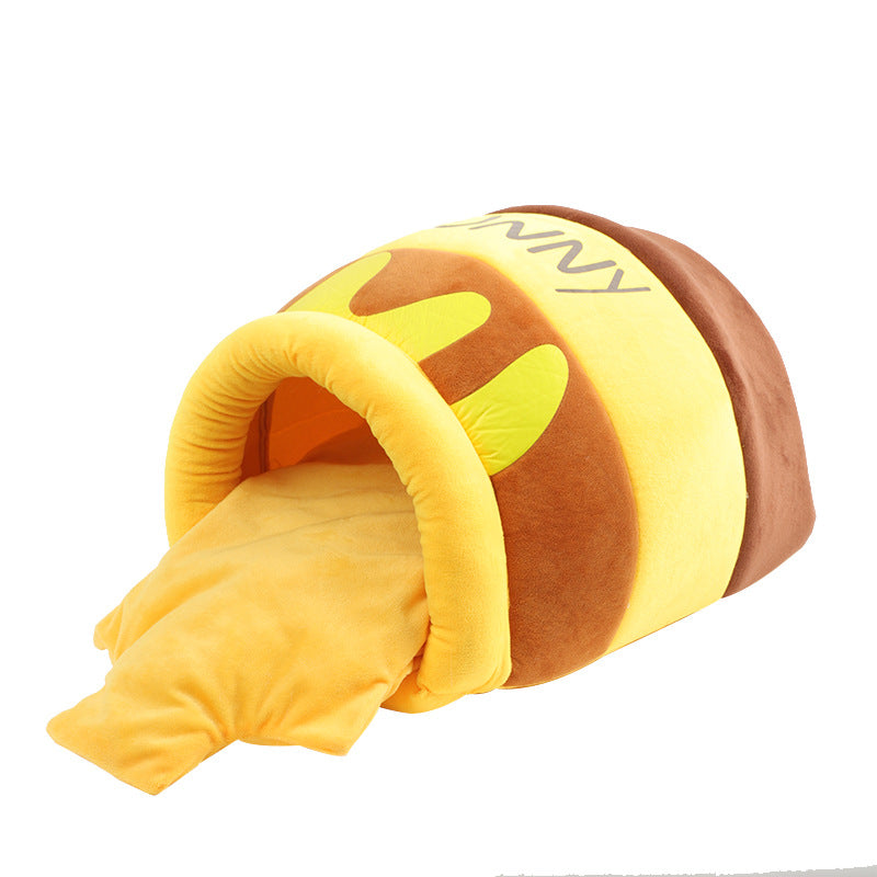 Yellow and brown Honey Pot cat cave bed on a white background, shaped like a plush honey pot with a soft entry.