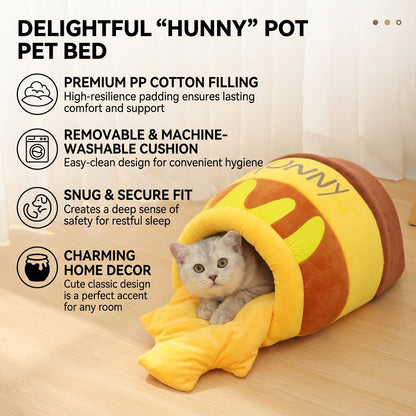 A cute silver tabby kitten resting comfortably inside an aesthetic yellow and brown honey pot shaped cat cave bed with a plush removable cushion.