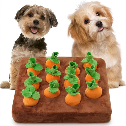 Two small dogs pose on a white background beside a brown Interactive Carrot Patch Dog Puzzle Toy with orange plush carrots.