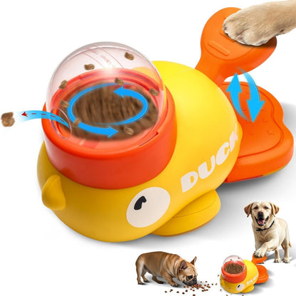 White-background studio shot of a yellow-and-orange duck puzzle toy and treat dispenser for dogs with kibble inside.