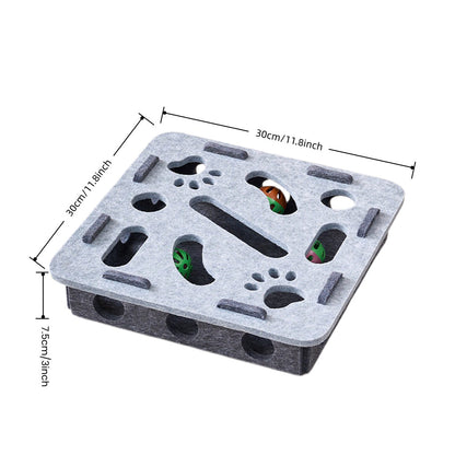 White background shows a gray felt cat puzzle box with cutout holes, colorful jingle balls, and 30cm dimension marks.