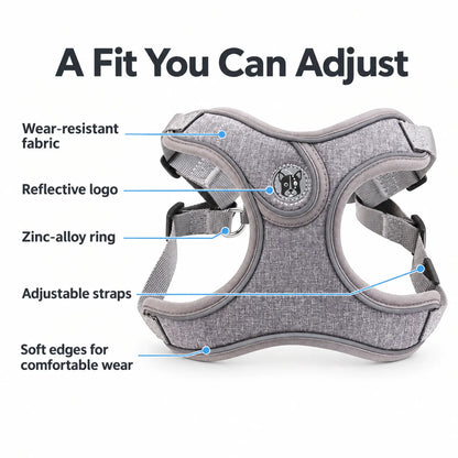 Gray dog harness showing adjustable straps, soft edges, reflective logo and wear-resistant fabric