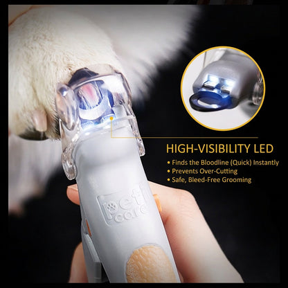 LED pet nail clippers illuminating a light-colored dog nail to help show the quick before trimming.