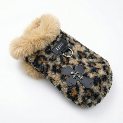 Leopard fleece dog winter jacket on a white background, with faux fur trim, built-in leash ring, and black paw applique.