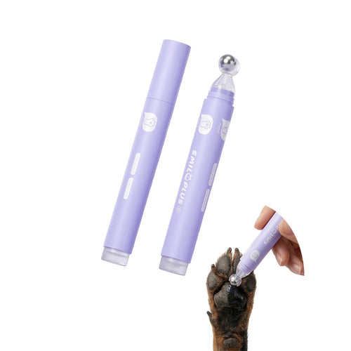 Lavender pet paw and nose balm roller with metal rollerball shown applying balm to a dog paw.