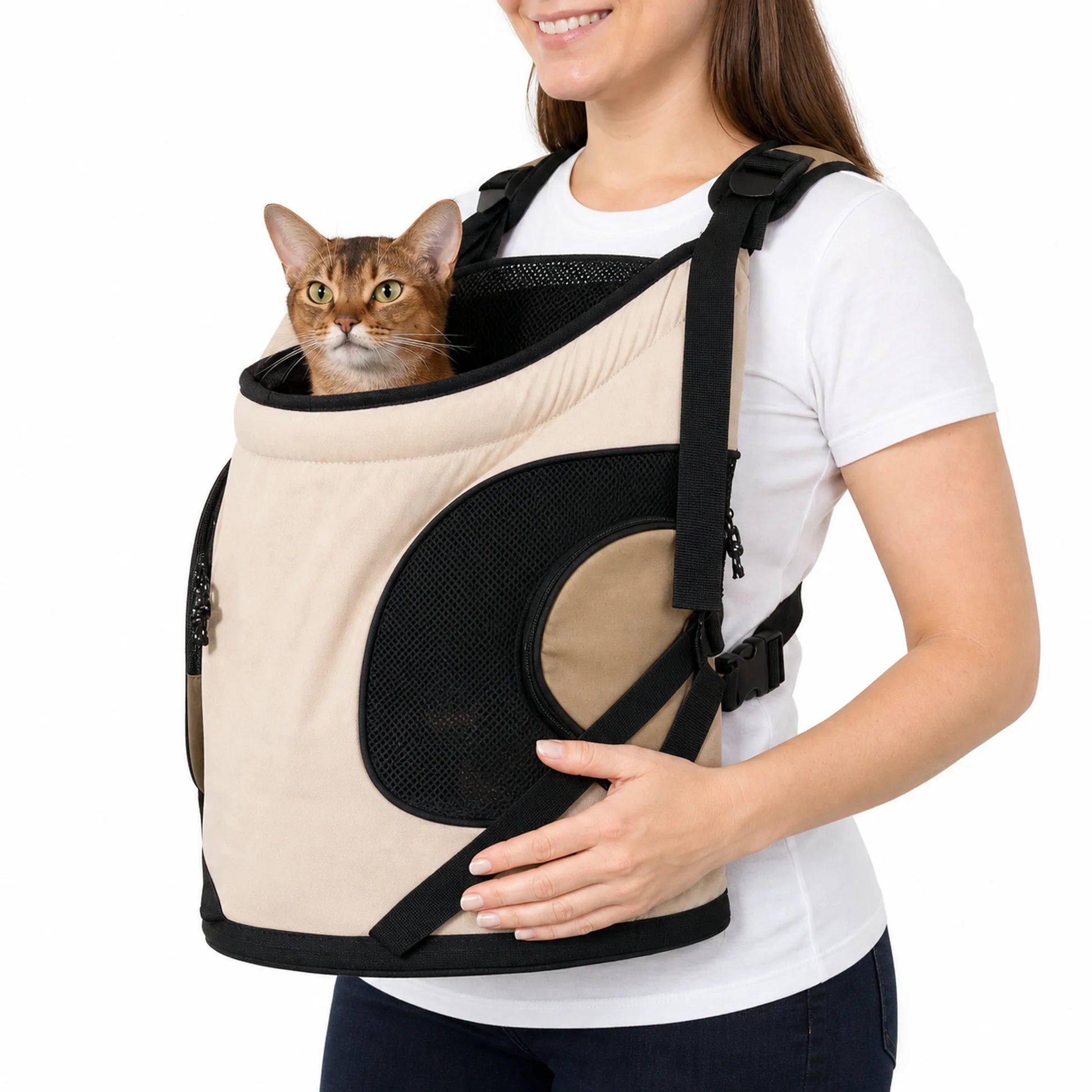 Cream front pet carrier worn on the chest with a brown cat