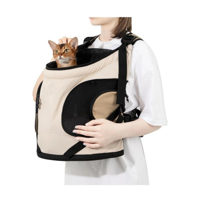 Cream front pet carrier worn with a cat inside
