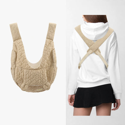 Khaki quilted front pet carrier with crossed back straps, side pockets and safety tether detail