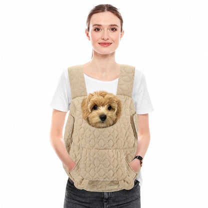 Khaki quilted front pet carrier worn by a woman with a small dog seated inside