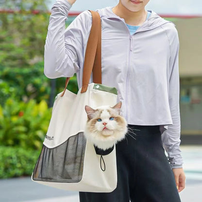 Cream mesh pet tote carrier worn outdoors with a cat