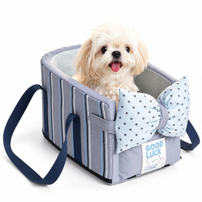 Small white dog in the Blue Stripe console dog car seat with a pale-blue dotted bow-shaped front cushion on white