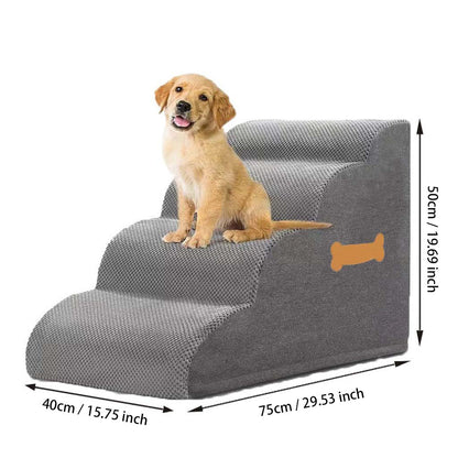 Golden retriever puppy sits on gray orthopedic foam dog stairs and pet ramp, studio shot on white background with size markings.