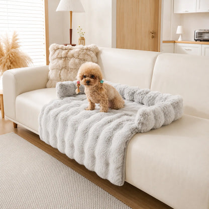 Silver-gray frosted faux-fur pet sofa cover with bolster, toy poodle resting on it