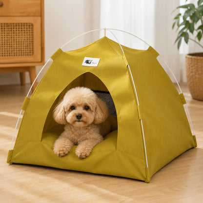Small dog resting inside an olive green foldable pet tent bed in a clean indoor room