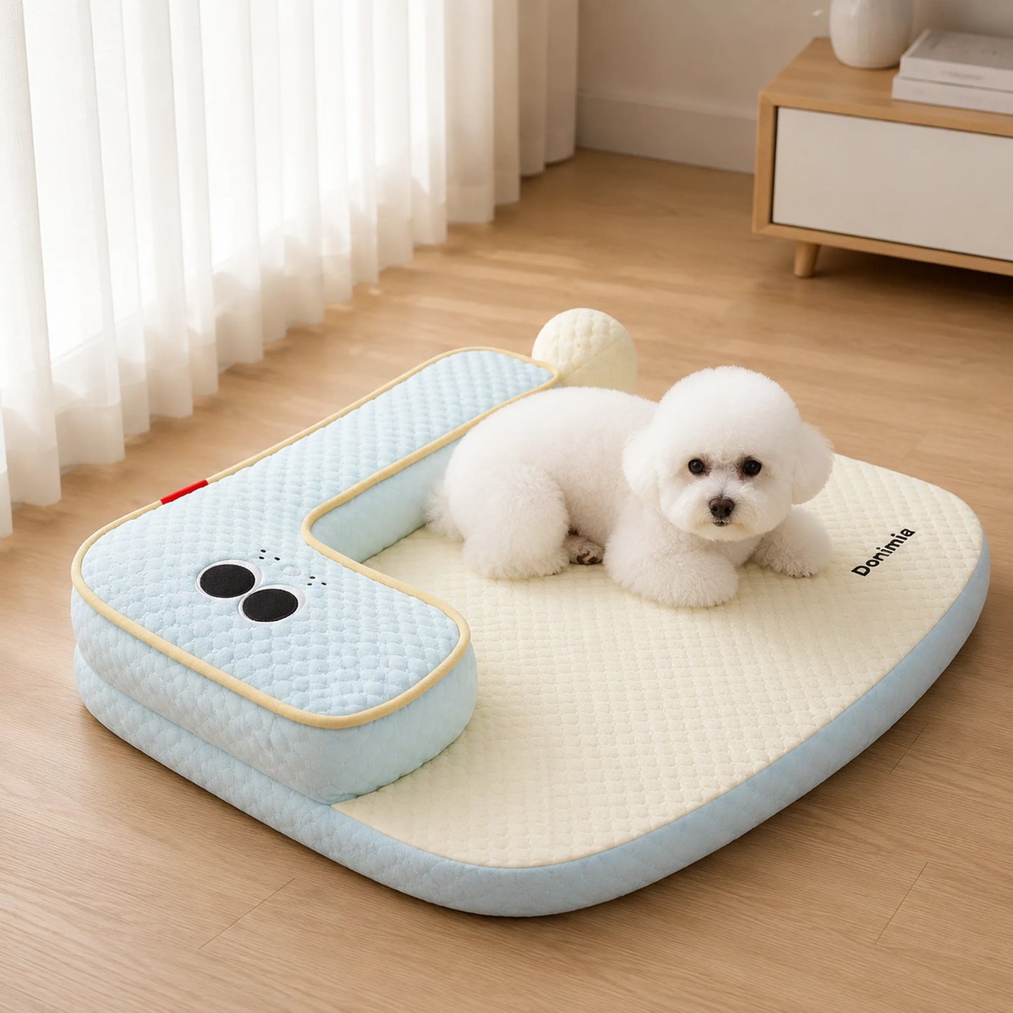 Small white dog resting on ice blue cooling pet sleep mat indoors