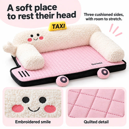Three plush bolsters on a pink dog bed with close-ups of the embroidered smile and quilting.