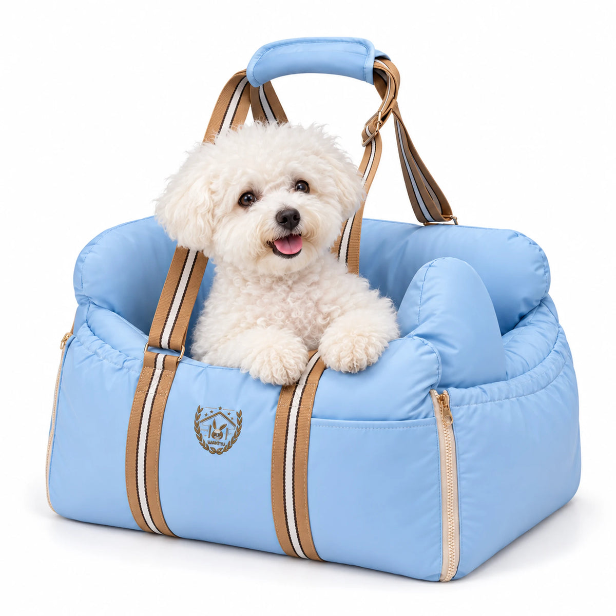 Small white Bichon sitting in a sky-blue padded pet carrier with striped handles on a white background.
