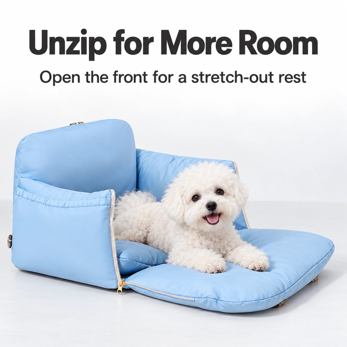 Sky-blue carrier with the front unzipped and lowered for a small white dog to lie down.