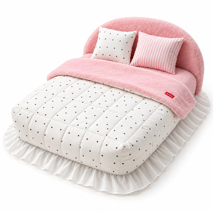 Pink & White Dots plush pet bed with a white quilt with black dots, two patterned pillows and a white ruffled skirt.