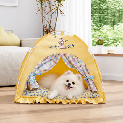 White Pomeranian lying inside a yellow bunny pet tent beside a sofa