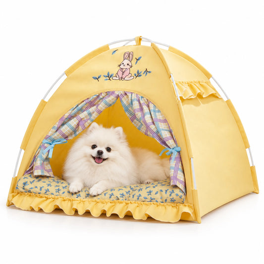 White Pomeranian resting in a yellow bunny pet tent bed on a white background