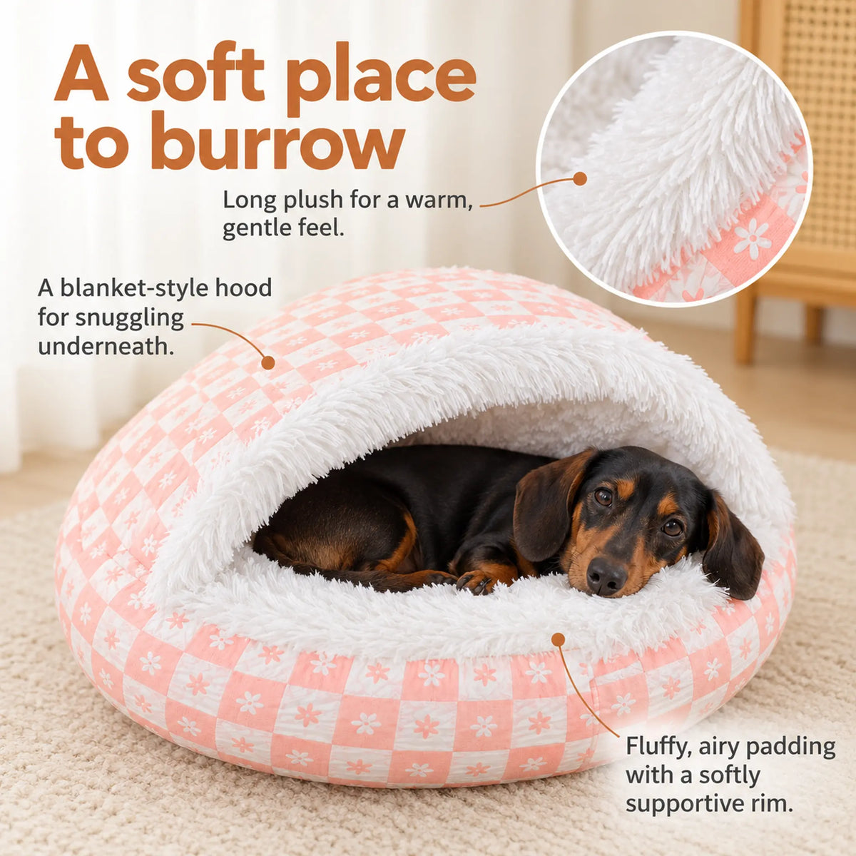 Dachshund tucked inside the pink pet bed, with details of the long plush lining and soft padded rim