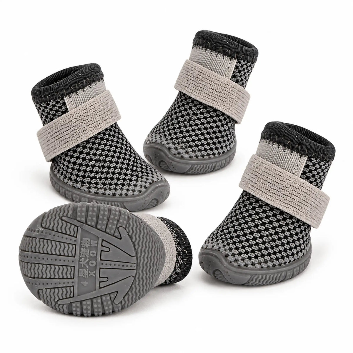 Set of four charcoal grey mesh dog shoes with gray elastic wrap straps and a rubber sole view