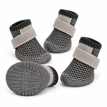 Set of four charcoal grey mesh dog shoes with gray elastic wrap straps and a rubber sole view
