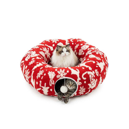 Festive Red Reindeer variant — Ragdoll cat lounging on top, tabby peeking from the tunnel of the red reindeer donut cat tunnel bed.