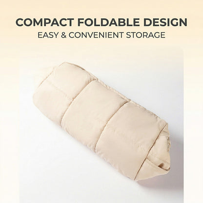 Folded khaki quilted cat sling carrier in compact roll for storage.