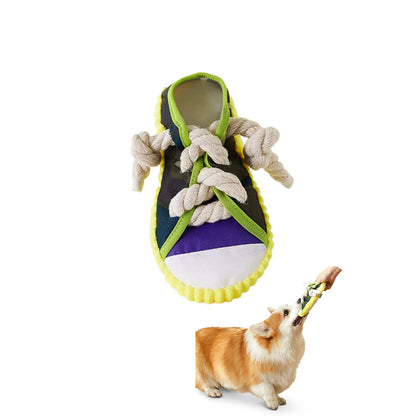 Squeaky sneaker dog toy with rope knot teether, shown on white background with a Corgi tugging the multicolor shoe.