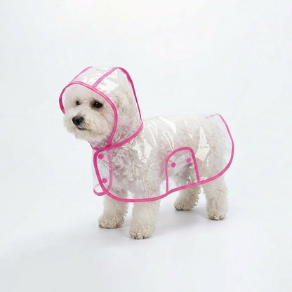 Small white dog wearing the transparent dog raincoat poncho with Bubblegum Pink trim on a white studio background.