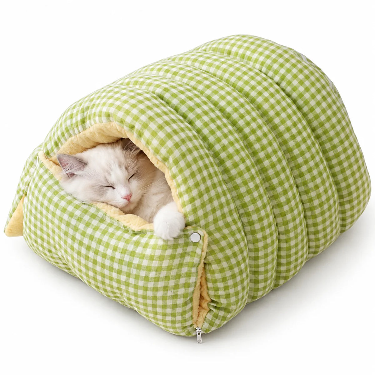 White cat sleeping inside a sage green gingham cave pet bed with plush lining.