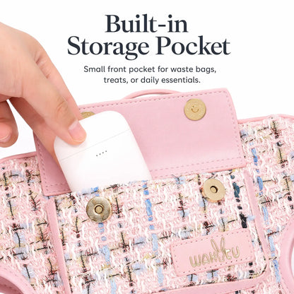 Front magnetic-snap pocket on pink tweed dog carrier harness opened to hold a wireless earbud case